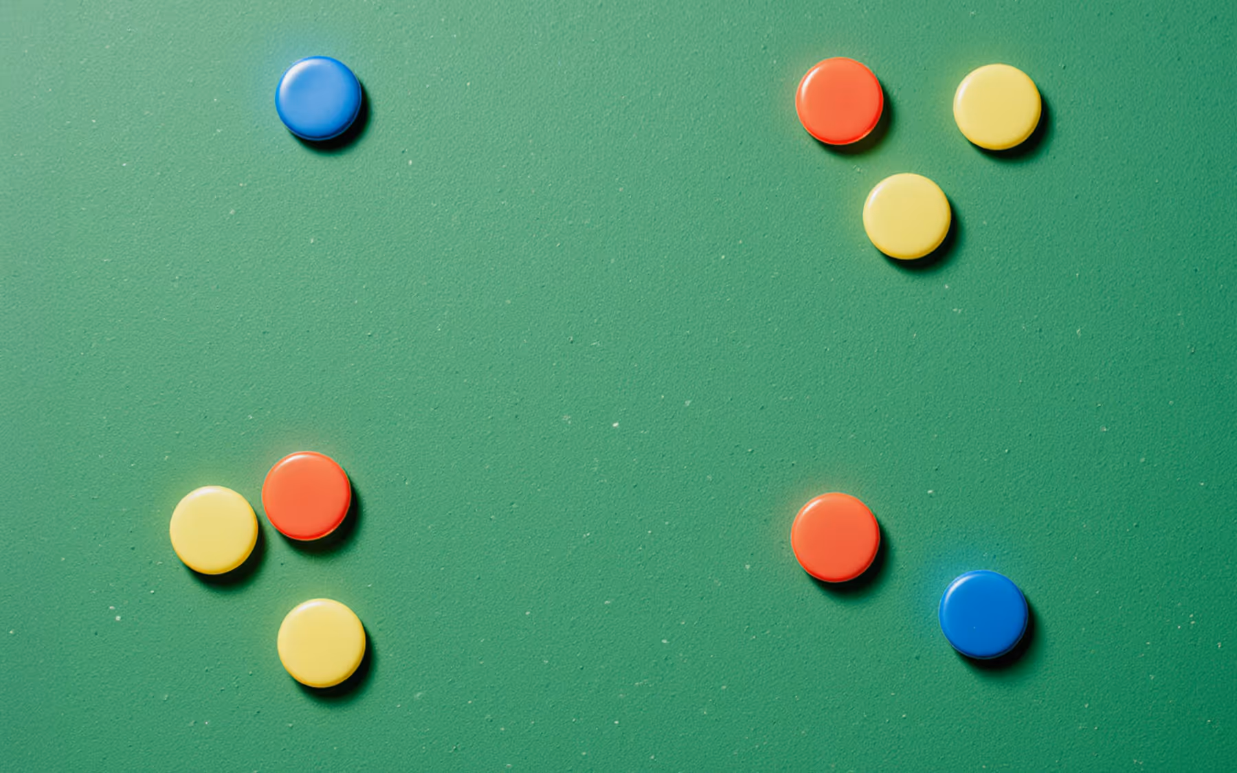 Green board for a meeting notes with colorful magnets
